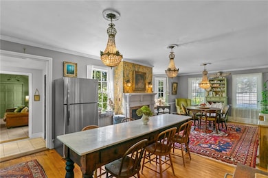 Front to back kitchen and dining with gas burning fireplace and window seat.