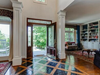 Stately Entrance opens to Library, formal dining a