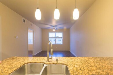 Kitchen featuring decorative light fixtures, light