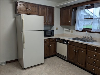 Kitchen with a window overlooking the back deck