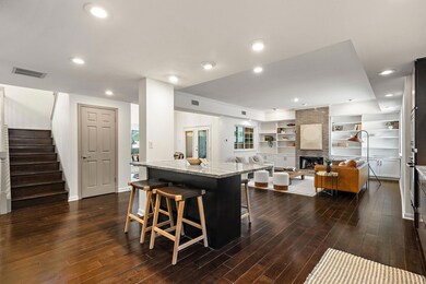 Kitchen with visible vents, dark wood-style floor