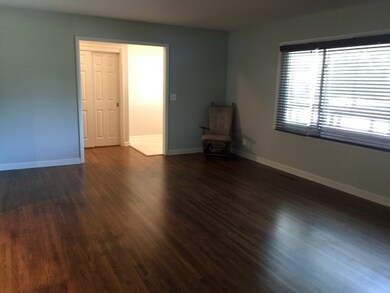 Living room features original wood floors