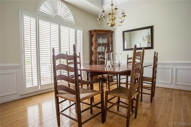 This dining room with tray ceiling and angelic sur