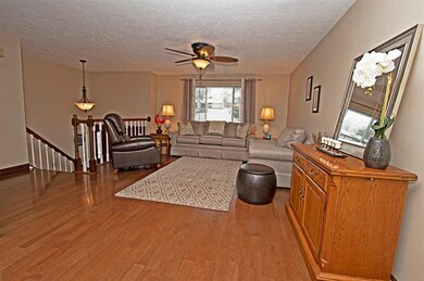 Spacious living room with hardwood floors and upgr