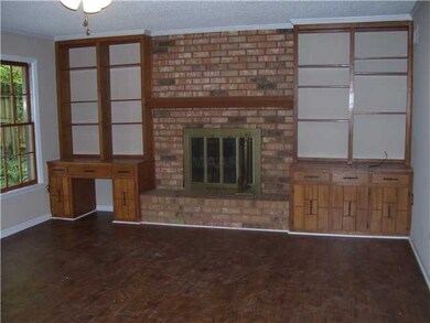 18.4x14.8 den has wood floor, bookcases and woodbu