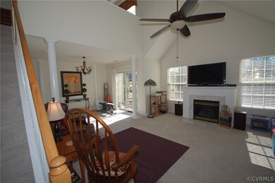 Spacious family room has Palladian window, ceiling
