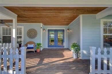 Welcoming covered front porch with tongue & groove