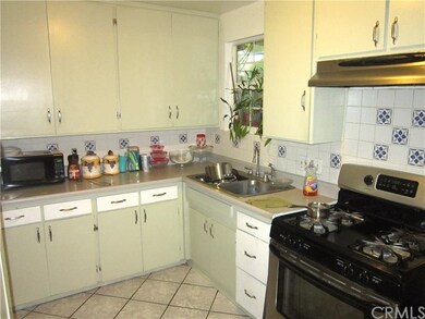 Custom installed kitchen cabinetry and back splash