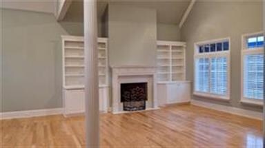 Open Family Room with wood floors and plenty of wi