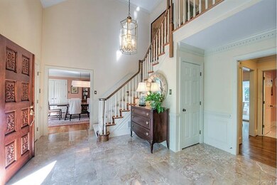 Alternate view of the 2-story foyer with raised pa
