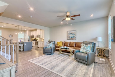 Living area with light wood-style flooring, recess