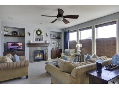 SPACIOUS, LIGHT-FILLED GREATROOM WITH STONE FIREPL