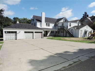 Exterior Back. The house is 17 rooms and a 3 car a