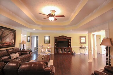 Looking to the other side of the living room with the abundance of natural lighting.