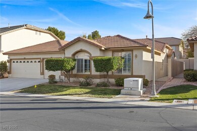 View of front of property with a tile roof, stucco