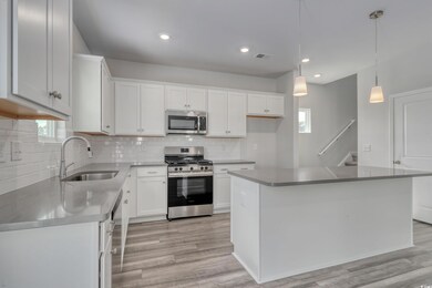Kitchen featuring a sink, stainless steel applianc