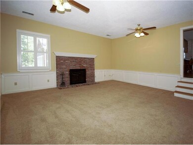 Spacious living room with a beautiful fireplace an
