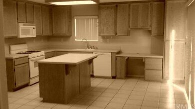 Center Island Kitchen with Corian Like Counters /O