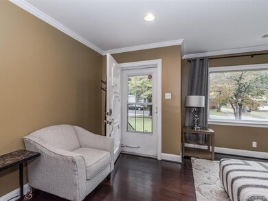 Entrance to living area featuring crown moulding, 