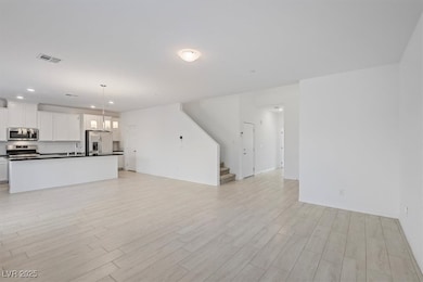 Large open concept living and dining room area with amazing natural light.