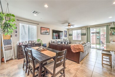 Dining space with a ceiling fan and recessed light