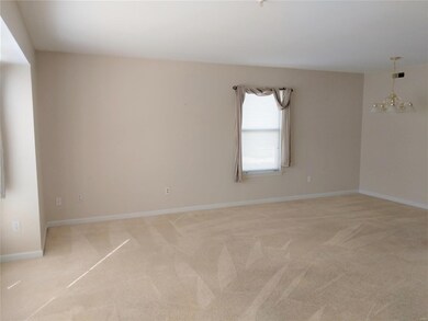Living room adjoins dining area