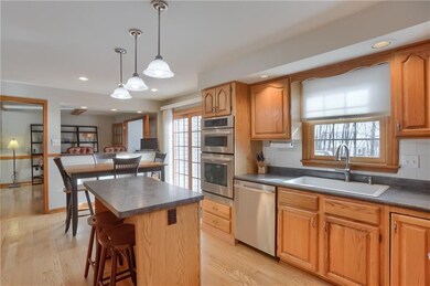Abundant cabinetry with shelf genie systems, casual seating at the island and a eat in dining area are highlights of the kitchen. Walk out access to the rear deck is provided here.