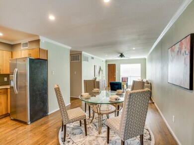 Dining open to living room and kitchen