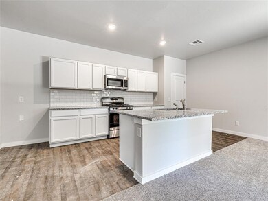 Kitchen - Granite countertops, bright cabinets, an
