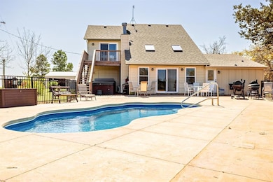 View of swimming pool with fence, a fenced in pool