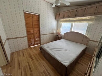 Bedroom with light hardwood / wood-style floors, a