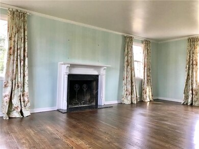 Plenty of light in this room with moldings