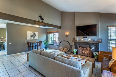 Cozy living room with warm fireplace.