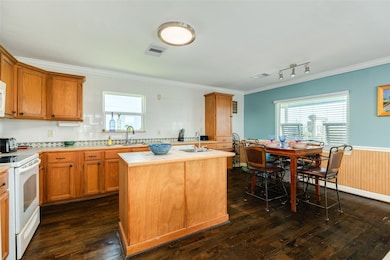 Great open kitchen and dining space.  Island has second sink.  Wood floors throughout home.