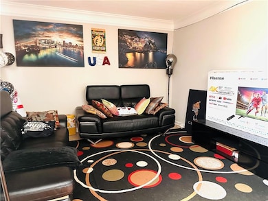 Living room featuring ornamental molding