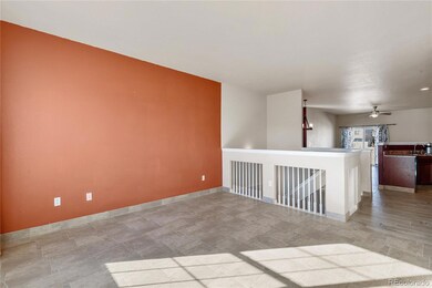Front family room with tile floors and accent wall