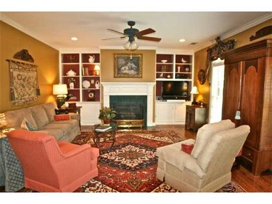 Fireplace with built-ins on either side.  Hardwood