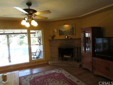 Bright open living room looks out to back porch & 