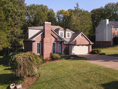 Mature landscaping complements a fully irrigated lawn.