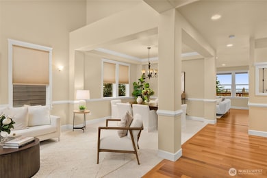 Opens to an inviting formal living + dinning room