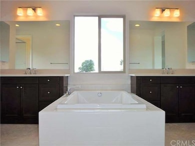 Soaking tub and vanities at Master Bath, with mode