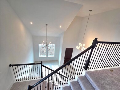 Staircase featuring a chandelier, carpet floors, high vaulted ceiling, and recessed lighting