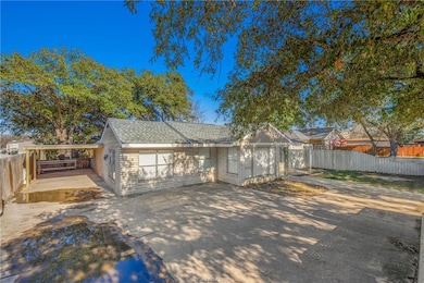 View of front facade featuring roof with shingles,