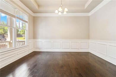 Empty room with a wainscoted wall, dark wood-style