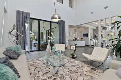 The formal dining room has triple sliding doors wi