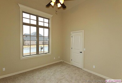 Study on the front of the home with vaulted ceilin