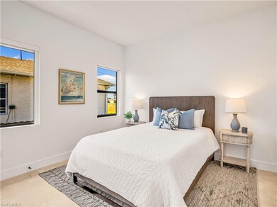 Bedroom with multiple windows and baseboards