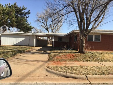 This dupuplex faces west.  Also shows the carport 