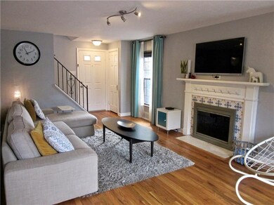 Another view of living room and its pretty firepla