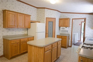 Kitchen view into laundry room
